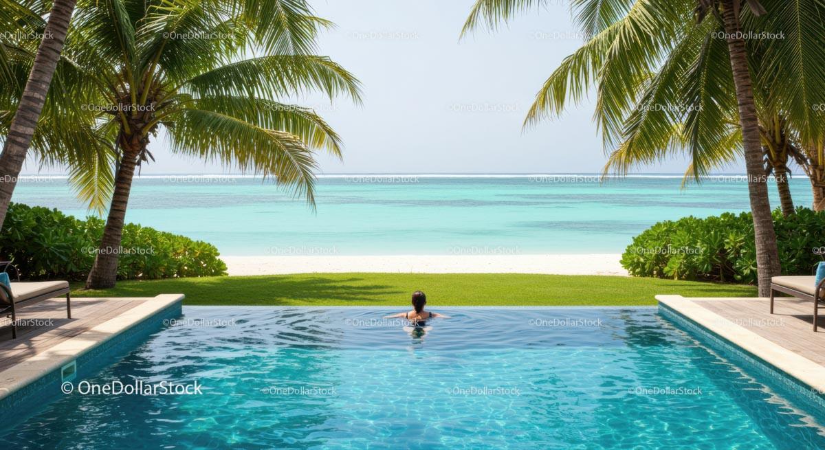 Infinity Pool Overlooking Tropical Beach and Ocean
