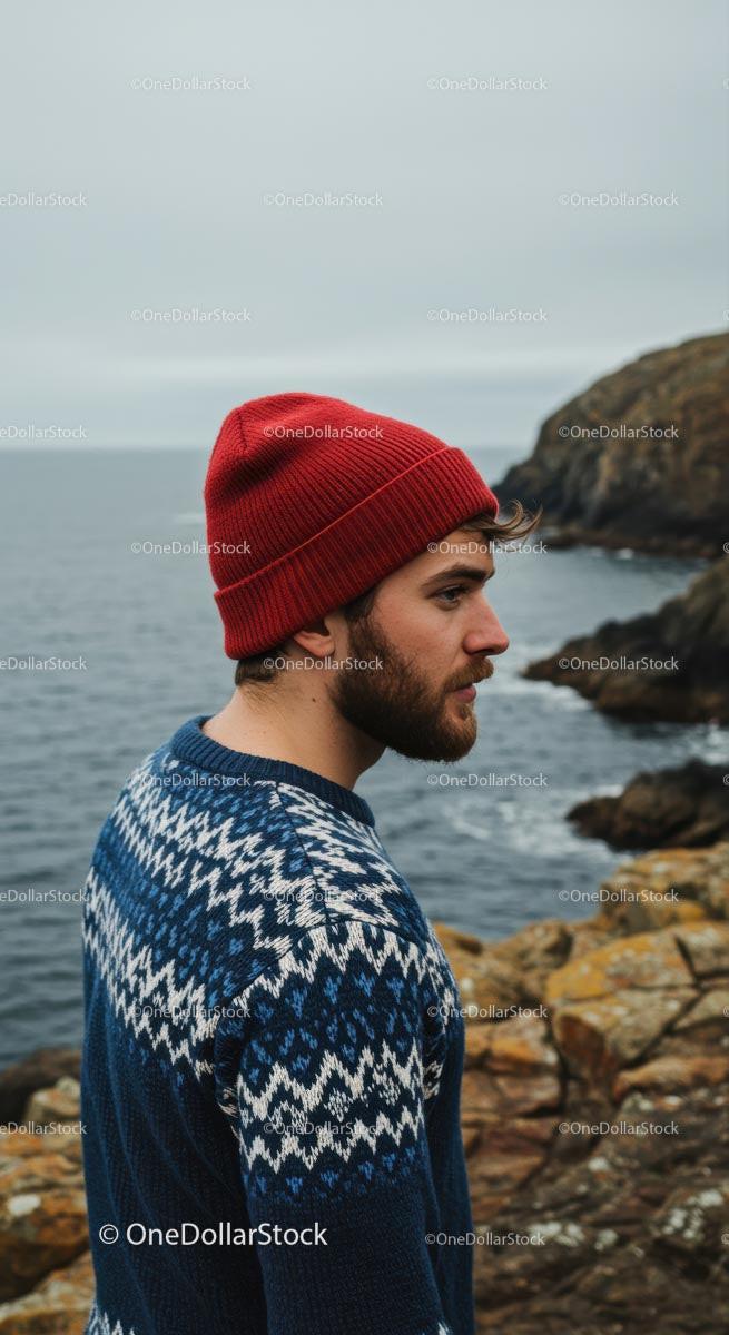 Man in Red Beanie by Rugged Coastal Cliffs