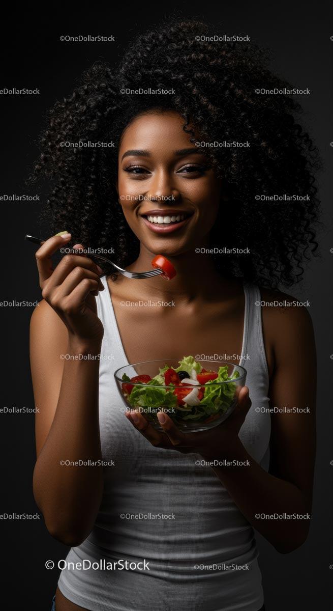 Woman Enjoying a Fresh Salad with a Smile