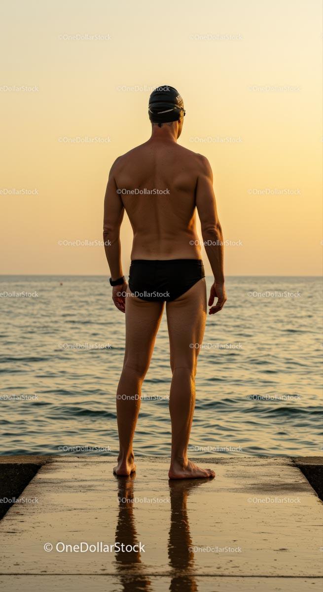 Swimmer Gazing at the Sunset Over Tranquil Ocean