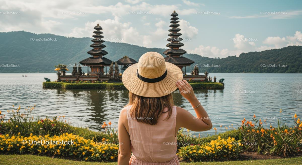 Woman in Hat Admiring Ulun Danu Bratan Temple in Bali Stock Photo Bundle preview 9
