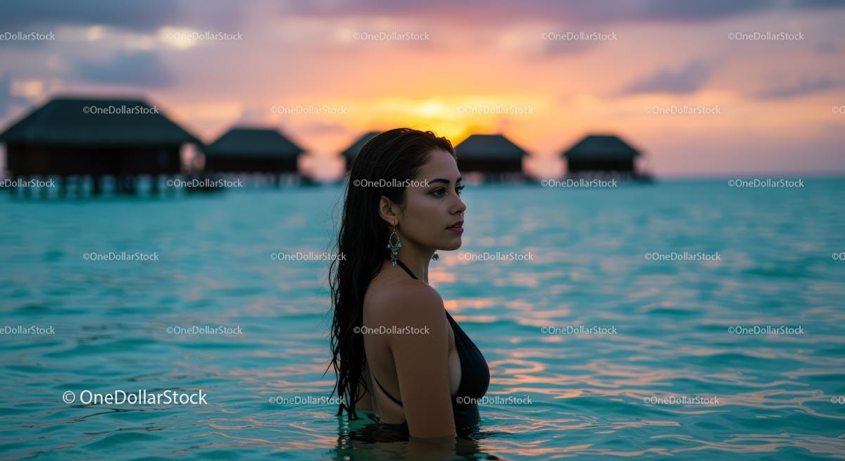 Woman Enjoying Sunset in Tropical Ocean Resort