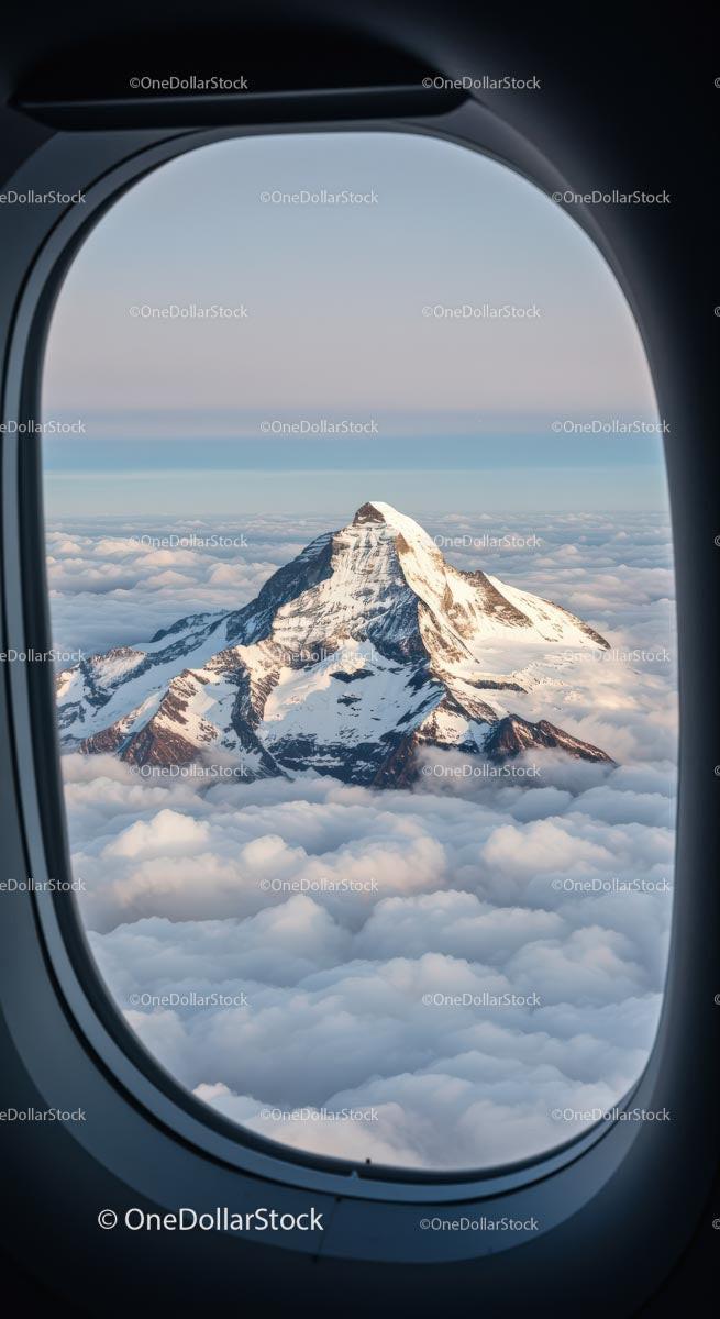 Snow-Capped Mountain Peak Viewed from Airplane Window