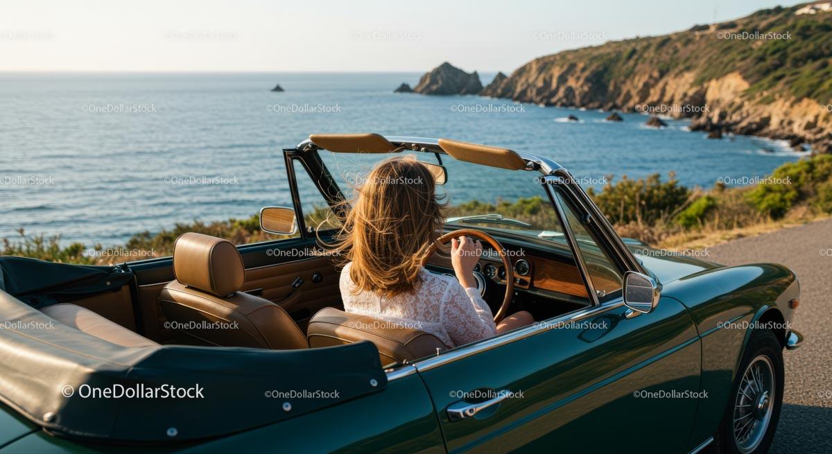 Woman Driving Convertible Car Along a Scenic Coastal Road
