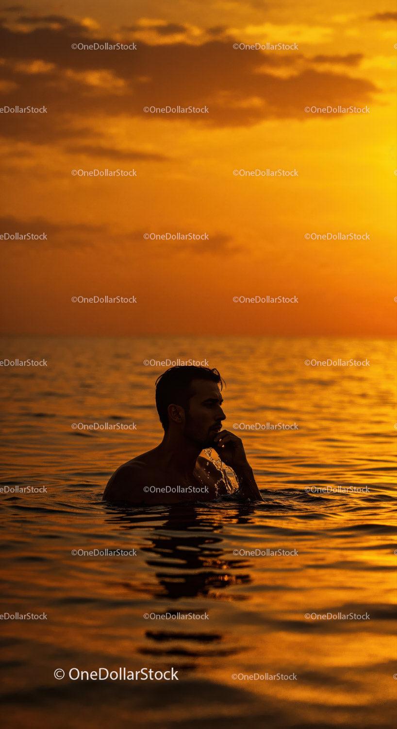 Serene Man Swimming in Ocean During Vibrant Sunset 15 JPG Files digital asset preview