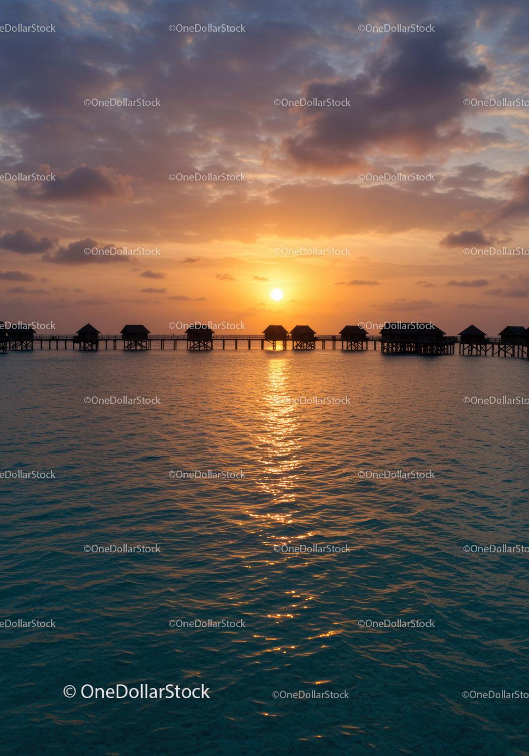 Sunset Overwater Bungalows with Colorful Sky and Calm Ocean