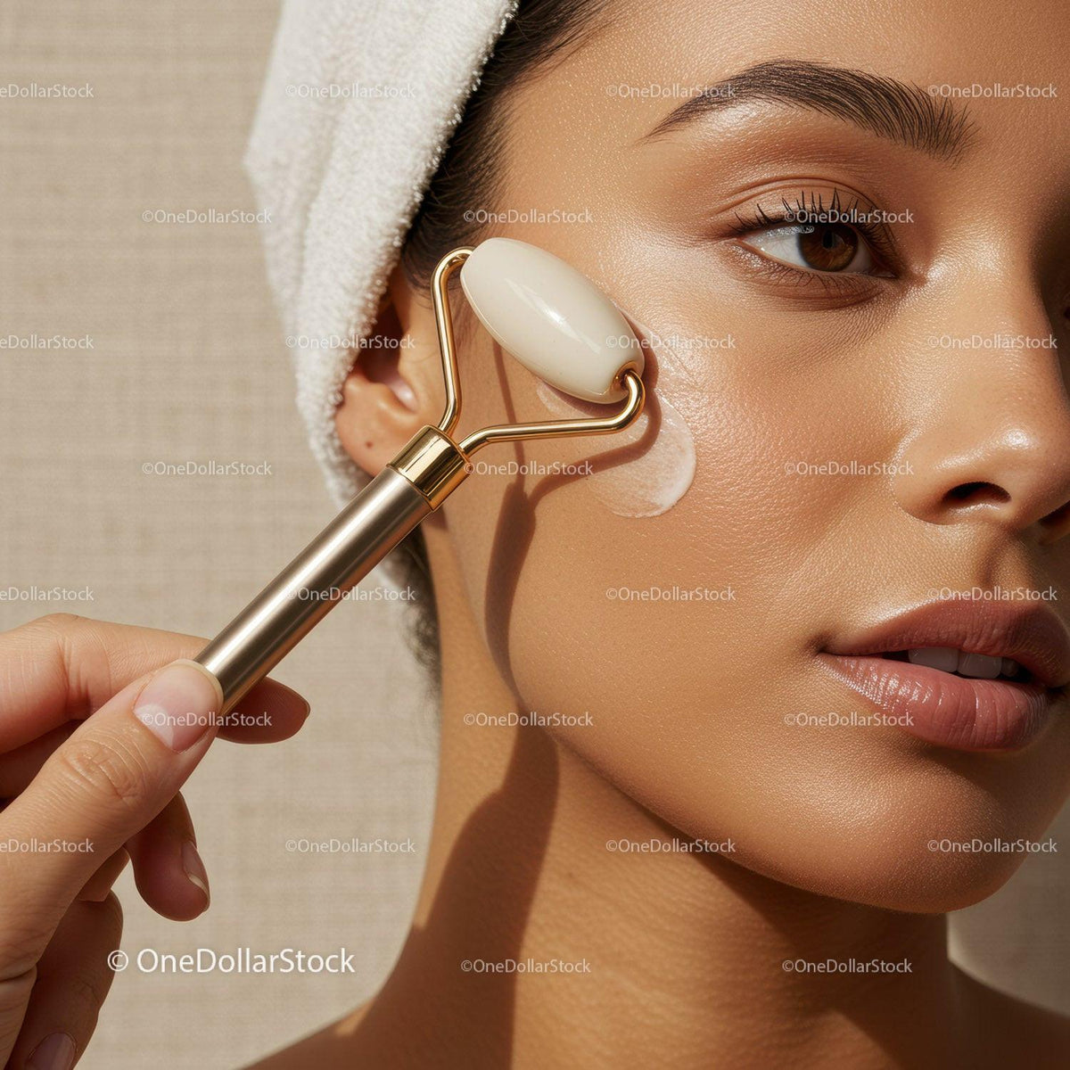 Close Up of Woman Using Facial Roller for Skin Rejuvenation with Natural Glow