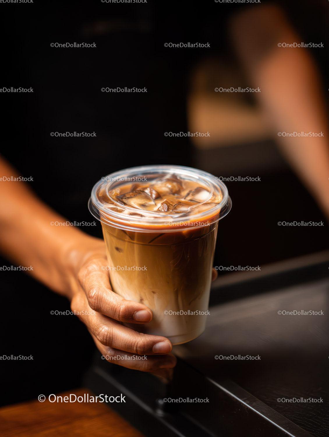 Glass of Iced Coffee with Milk and Ice Cubes in Dark Scene