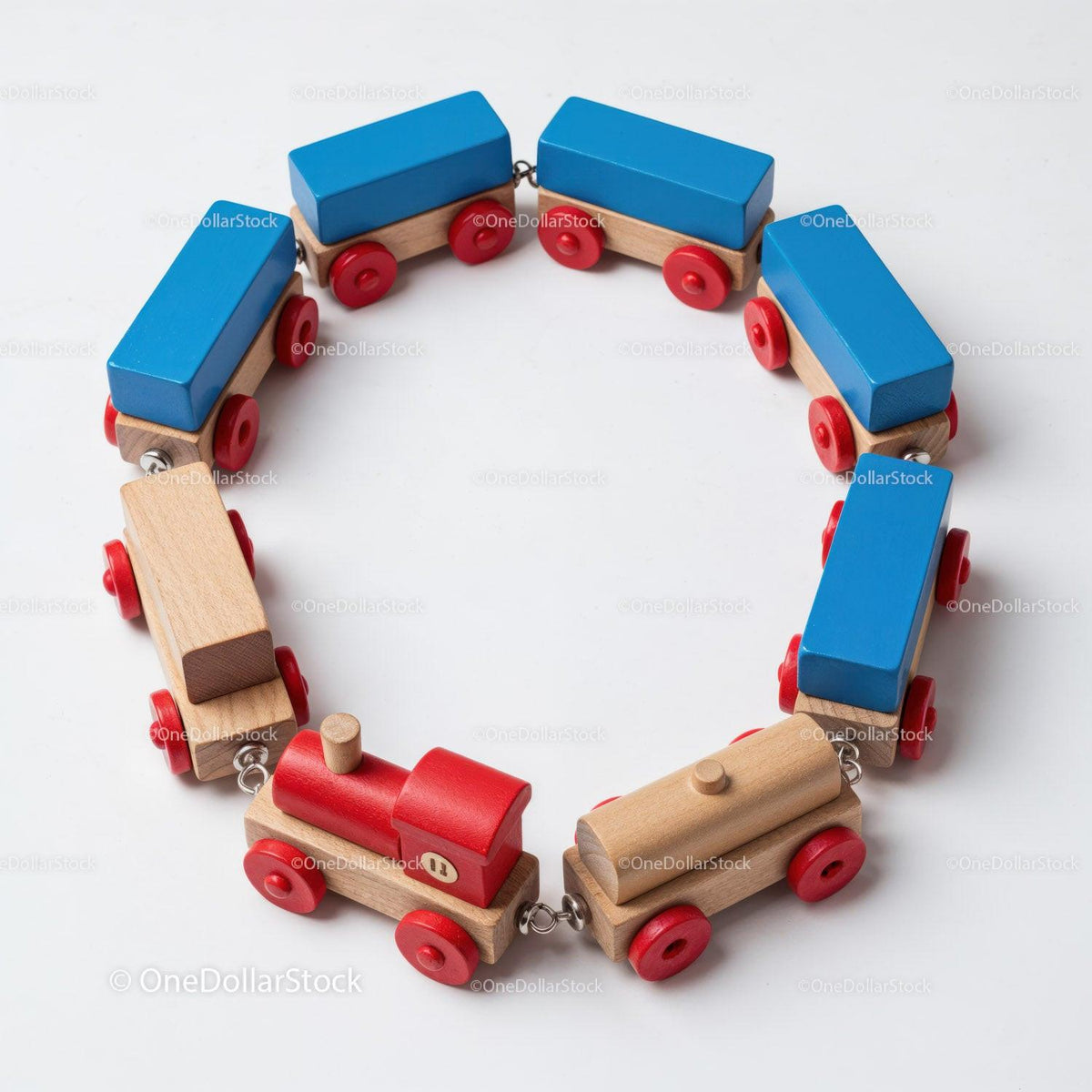Wooden toy train set arranged in a circle with red engine and blue cars