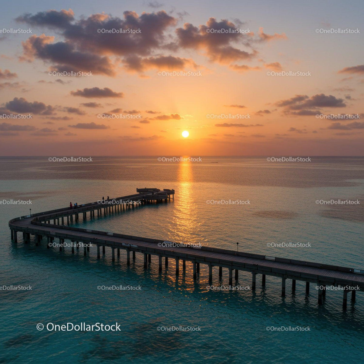 Scenic Sunset Over Ocean Pier with Clouds and Calm Water
