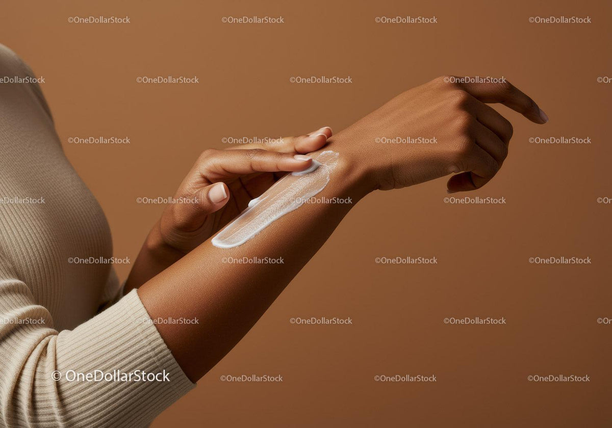 Close-up of Woman Applying Lotion to Arm for Skin Hydration