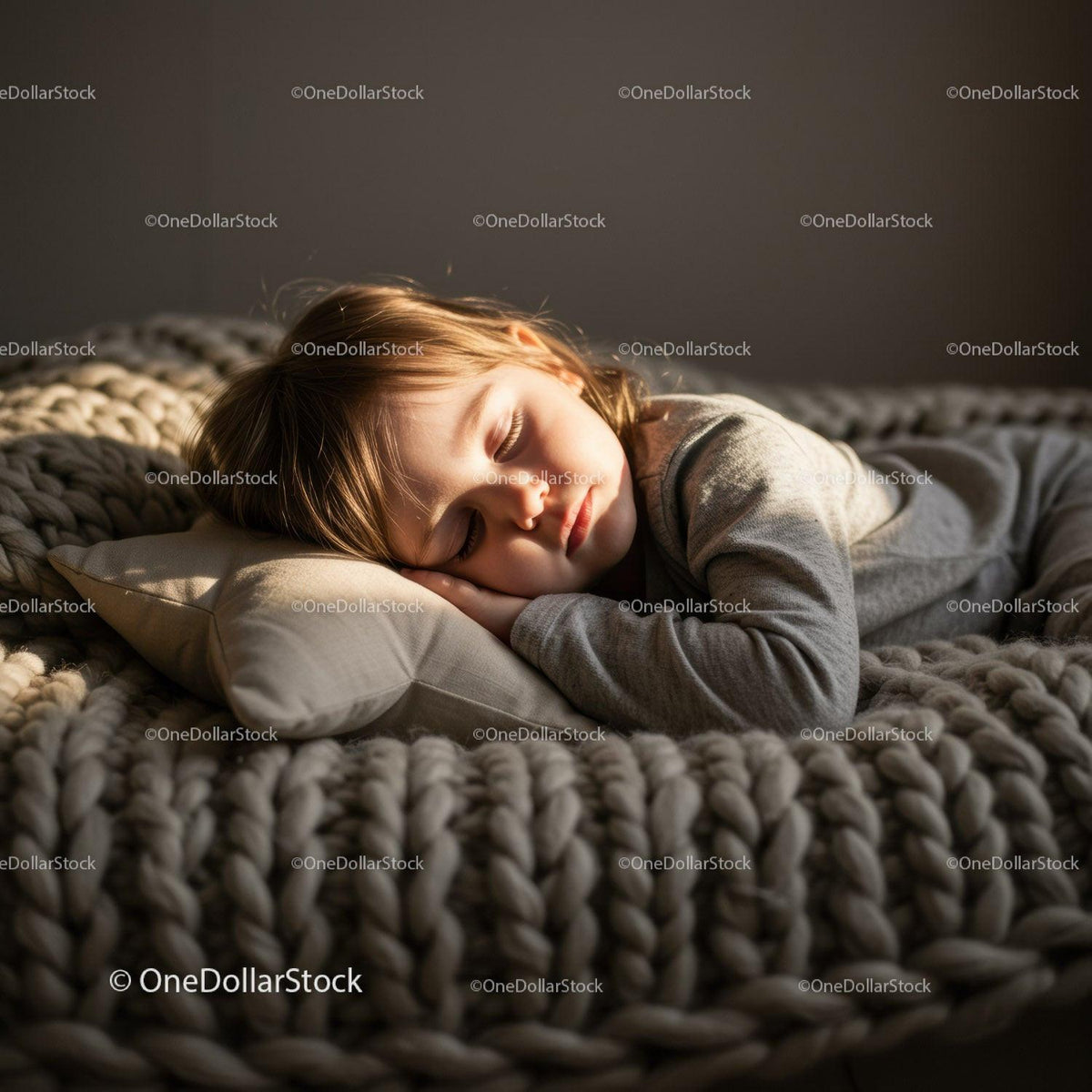 Peaceful child sleeping on cozy knitted blanket