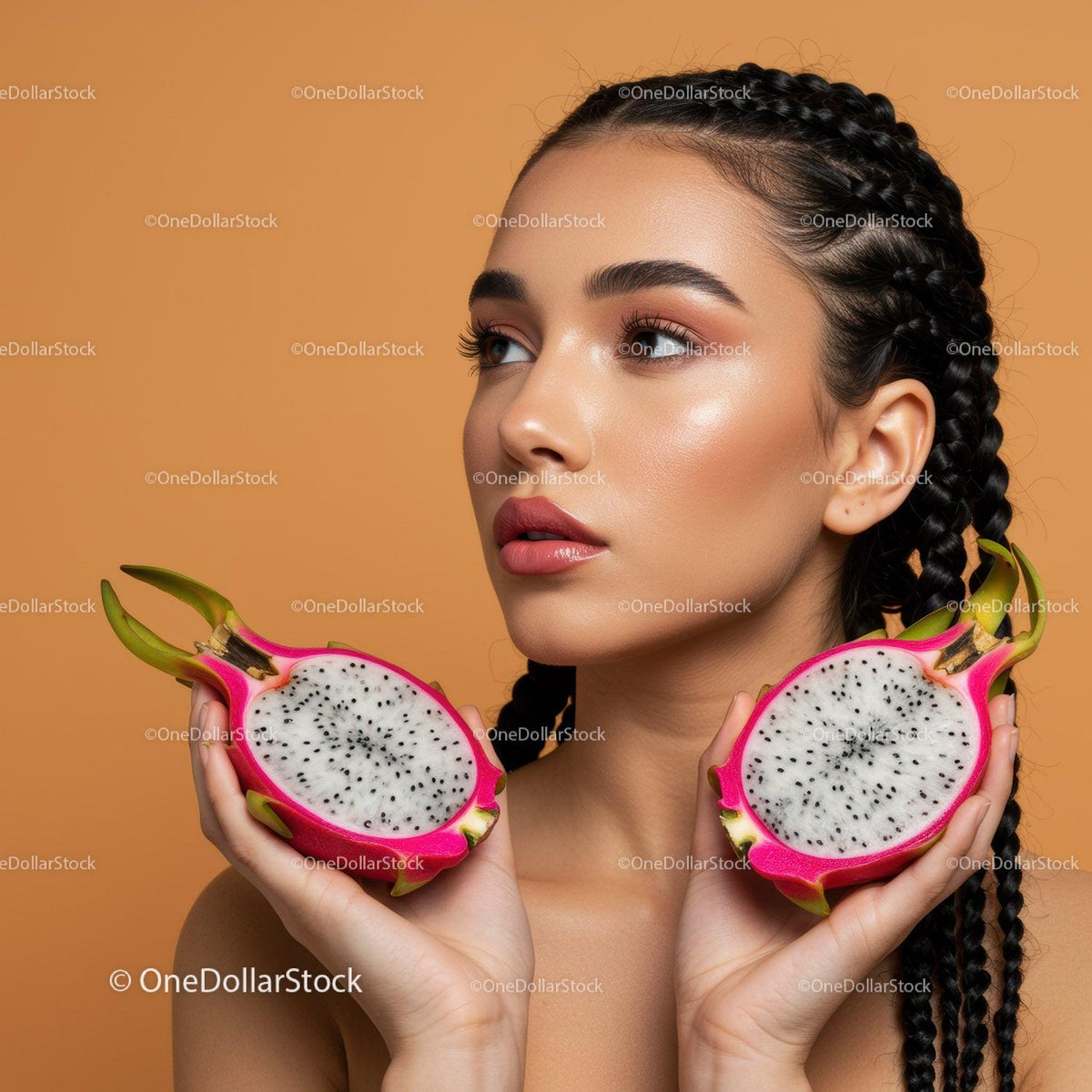 Young Woman with Braided Hair Holding Dragon Fruit Halves in Vibrant Setting