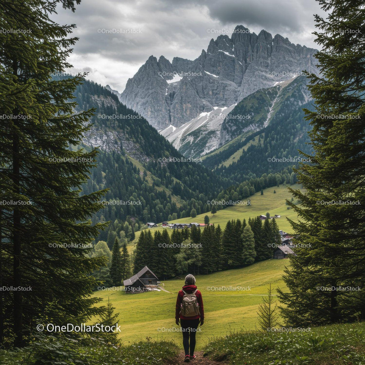 Majestic Mountain Range Surrounded by Green Forest and Cloudy Sky
