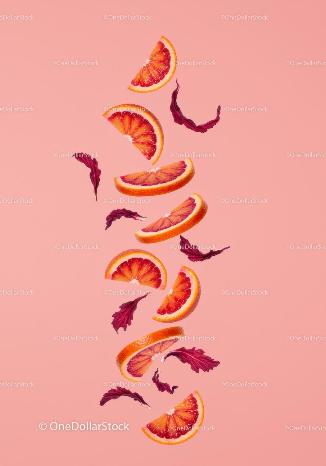 Floating Blood Orange Slices with Red Leaves on Pink