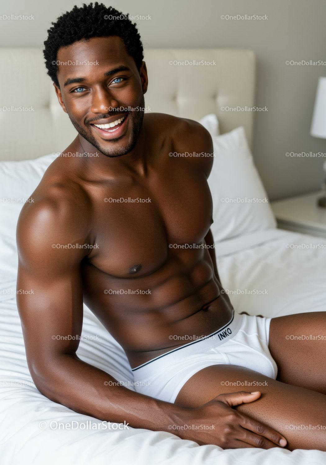 Smiling muscular man in white underwear relaxing on bed