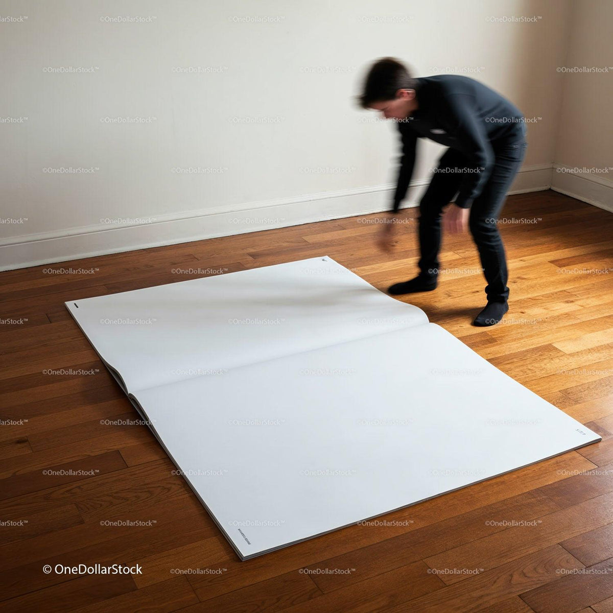Person unrolling giant blank sheet on wooden floor JPG Mockup Image preview