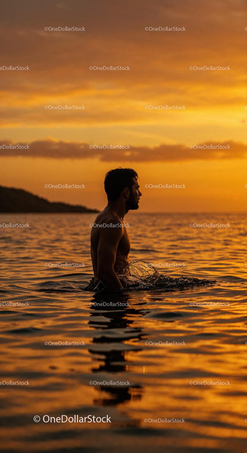 Serene Man Swimming in Ocean During Vibrant Sunset Stock Photo Bundle preview