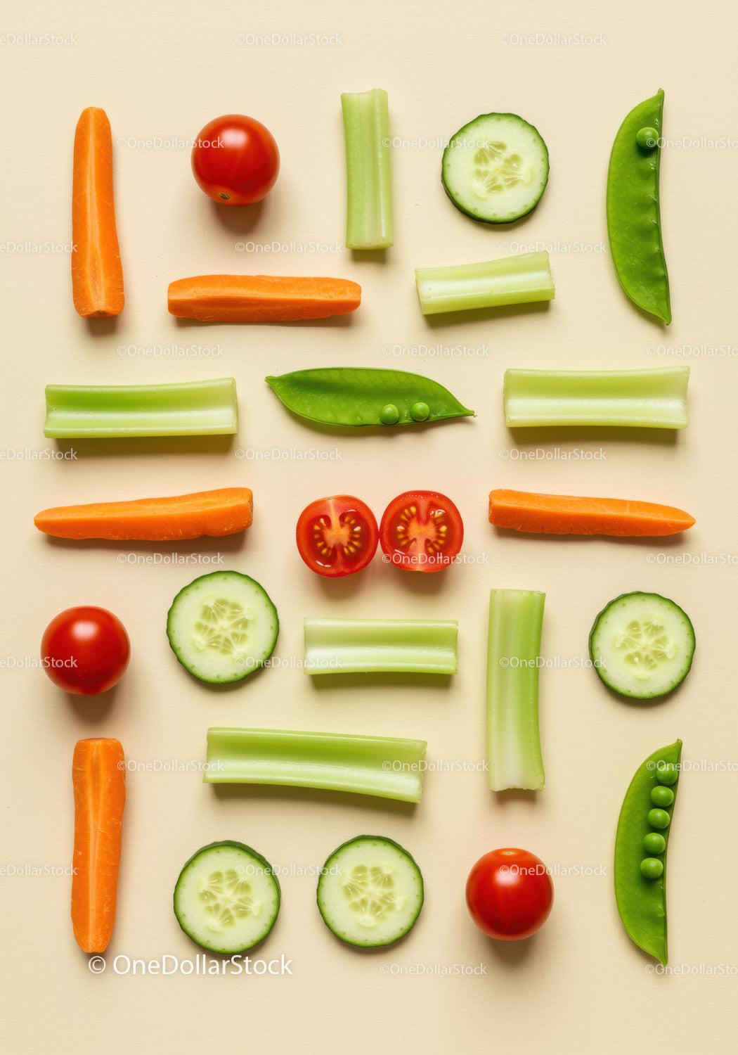 Assorted fresh vegetable pieces arranged on beige background