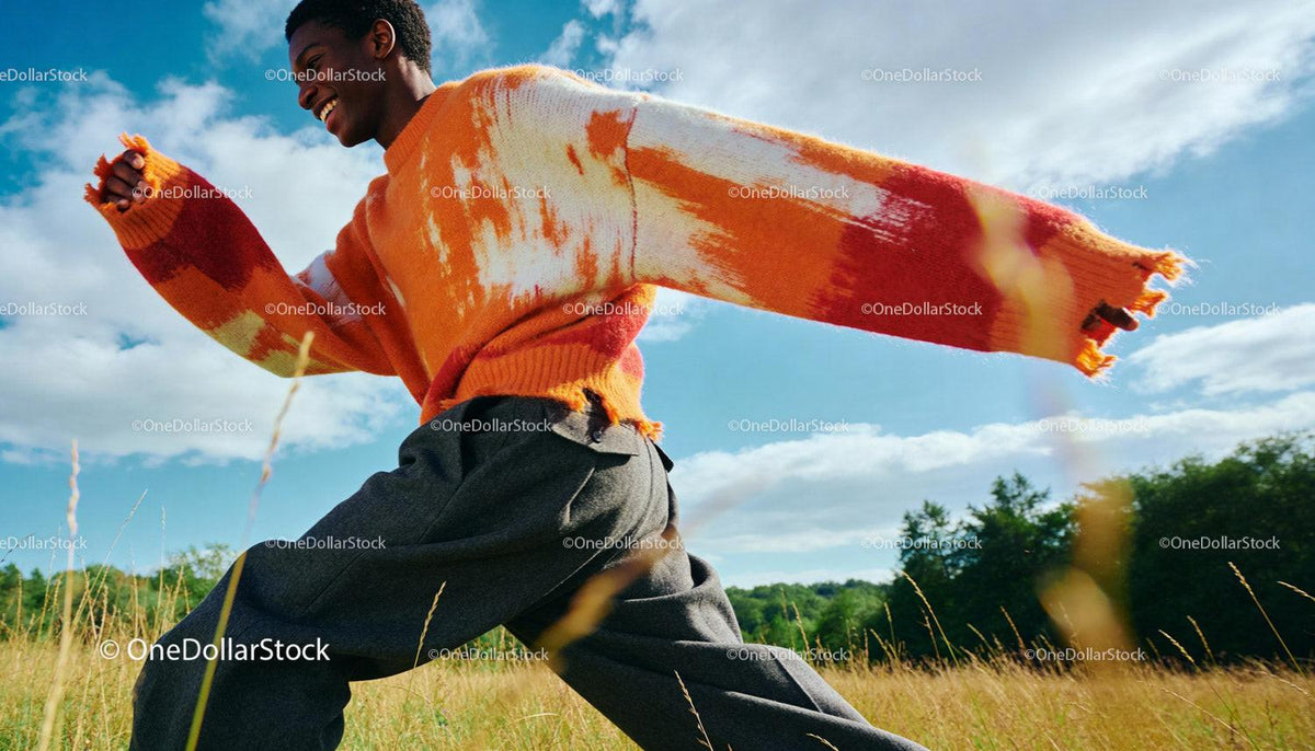 Man Joyfully Running in Vibrant Oversized Sweater