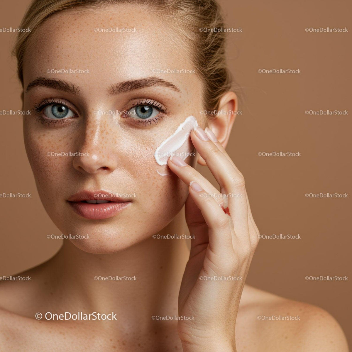 Portrait of a Young Woman Applying Moisturizer for Healthy Skin