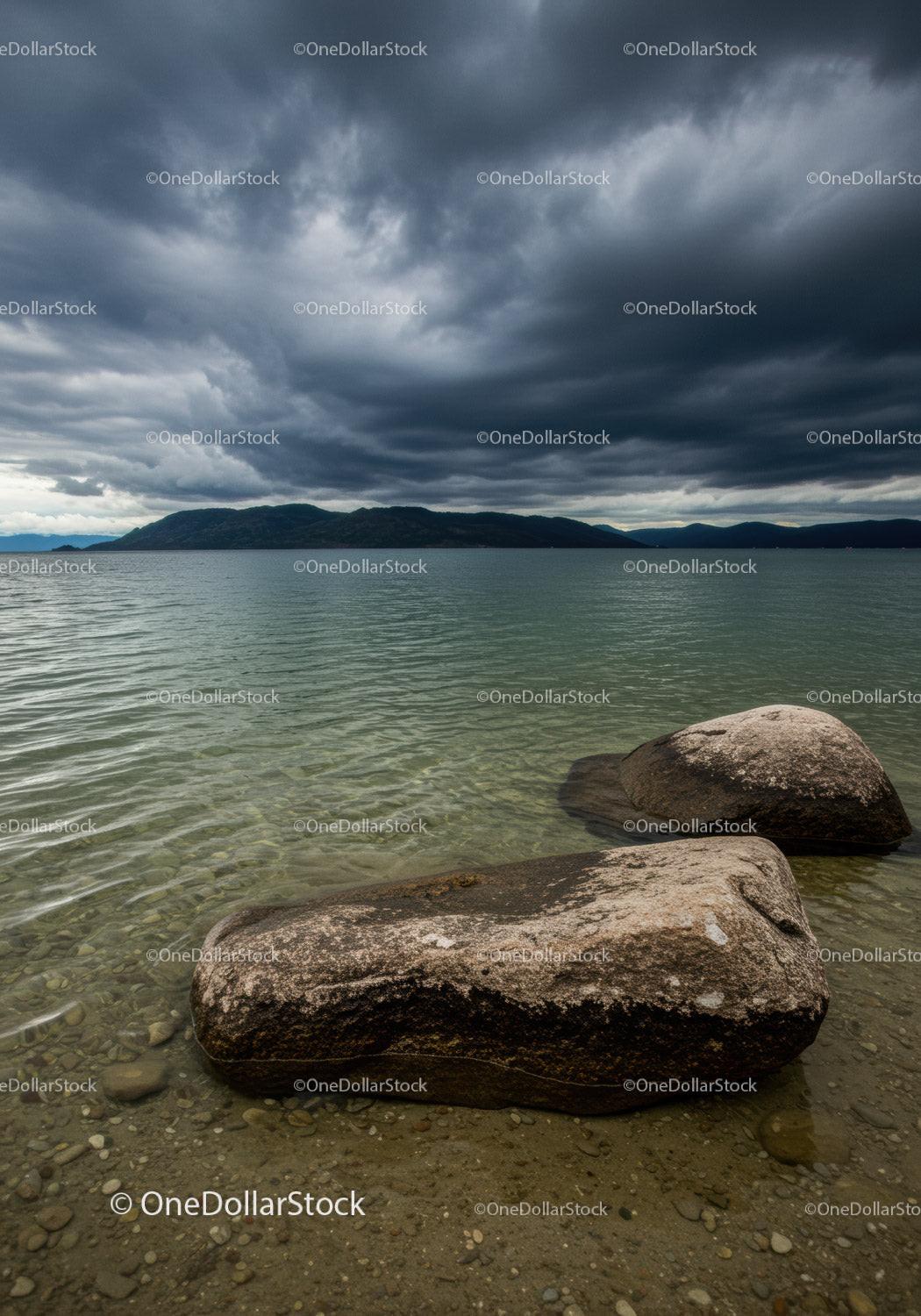 Calm lake shore under dramatic stormy sky