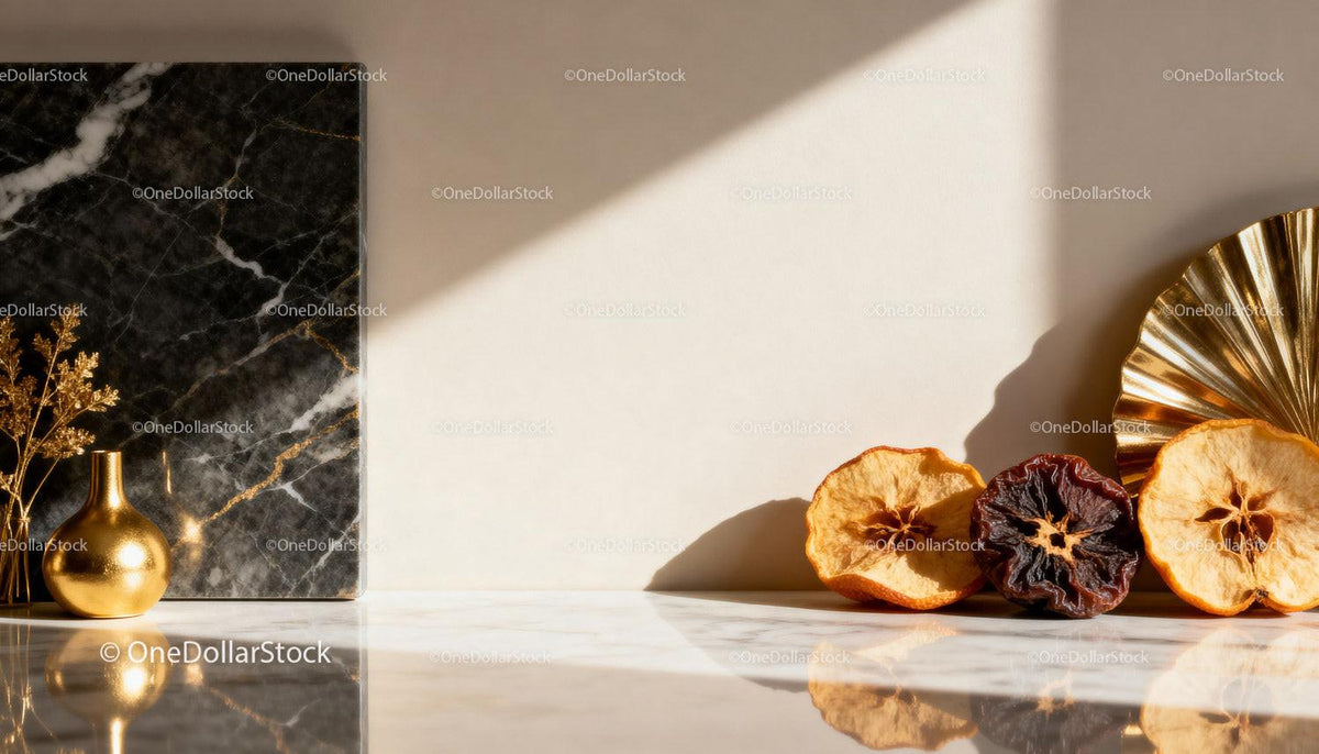 Decorative dried fruit and golden vase on marble surface