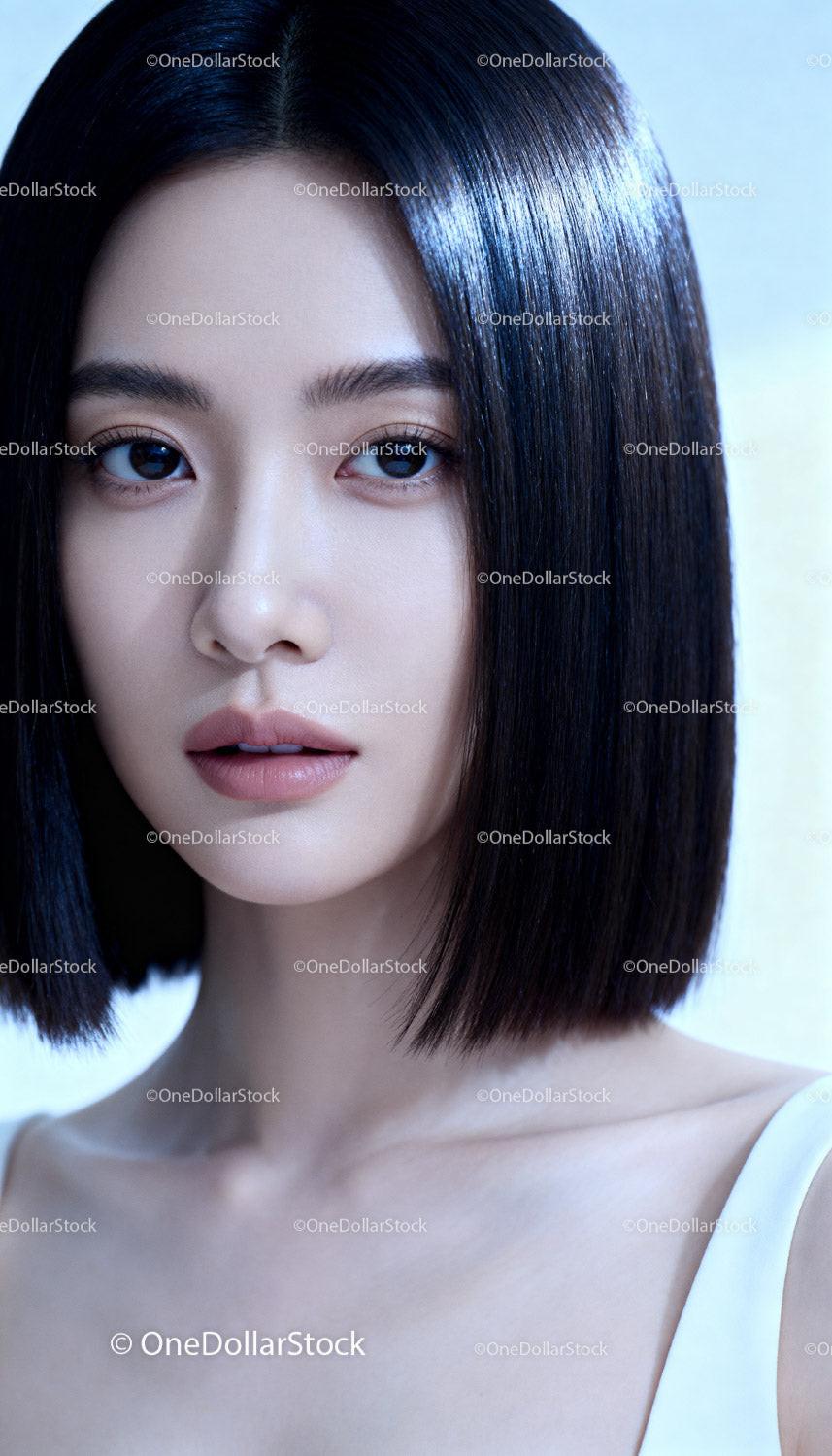 Elegant Asian woman with flawless skin and straight hair