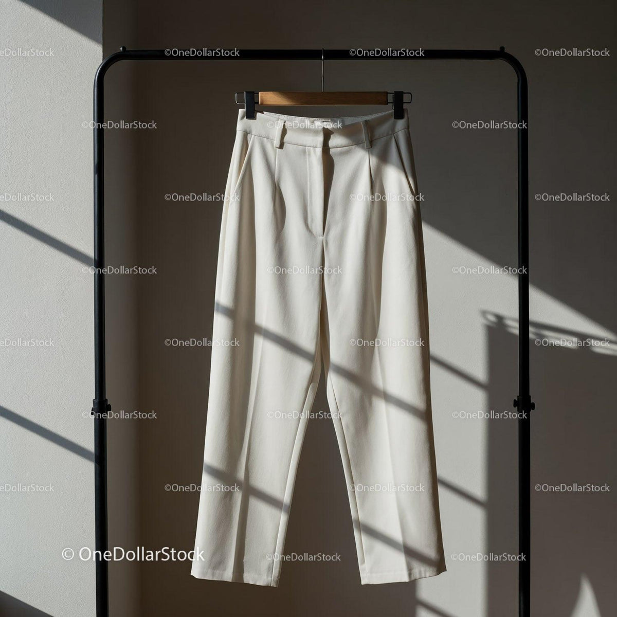 High Waist White Trousers Hanging on Minimalist Rack JPG Mockup Image preview