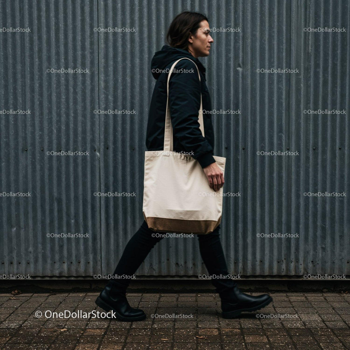 Man walking with canvas tote bag on urban street JPG Mockup Image preview