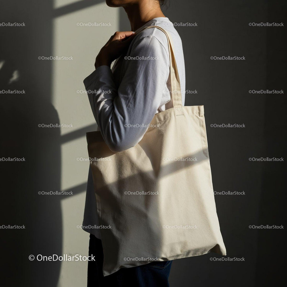 Person Carrying Plain Canvas Tote Bag on Shoulder JPG Mockup Image preview