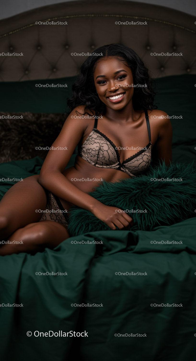Smiling woman relaxing on bed in elegant lingerie