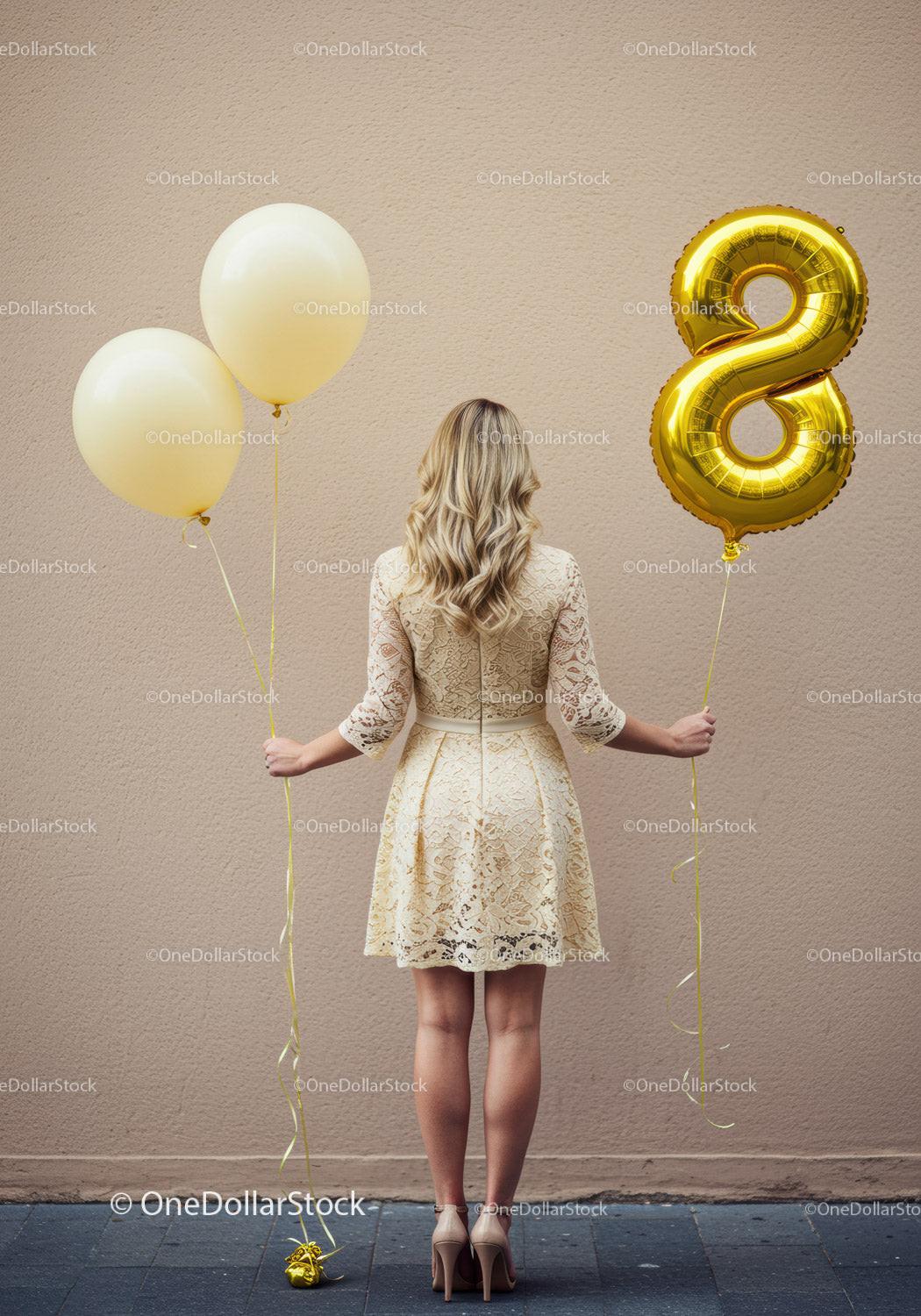 Woman celebrating with balloons and elegant lace dress