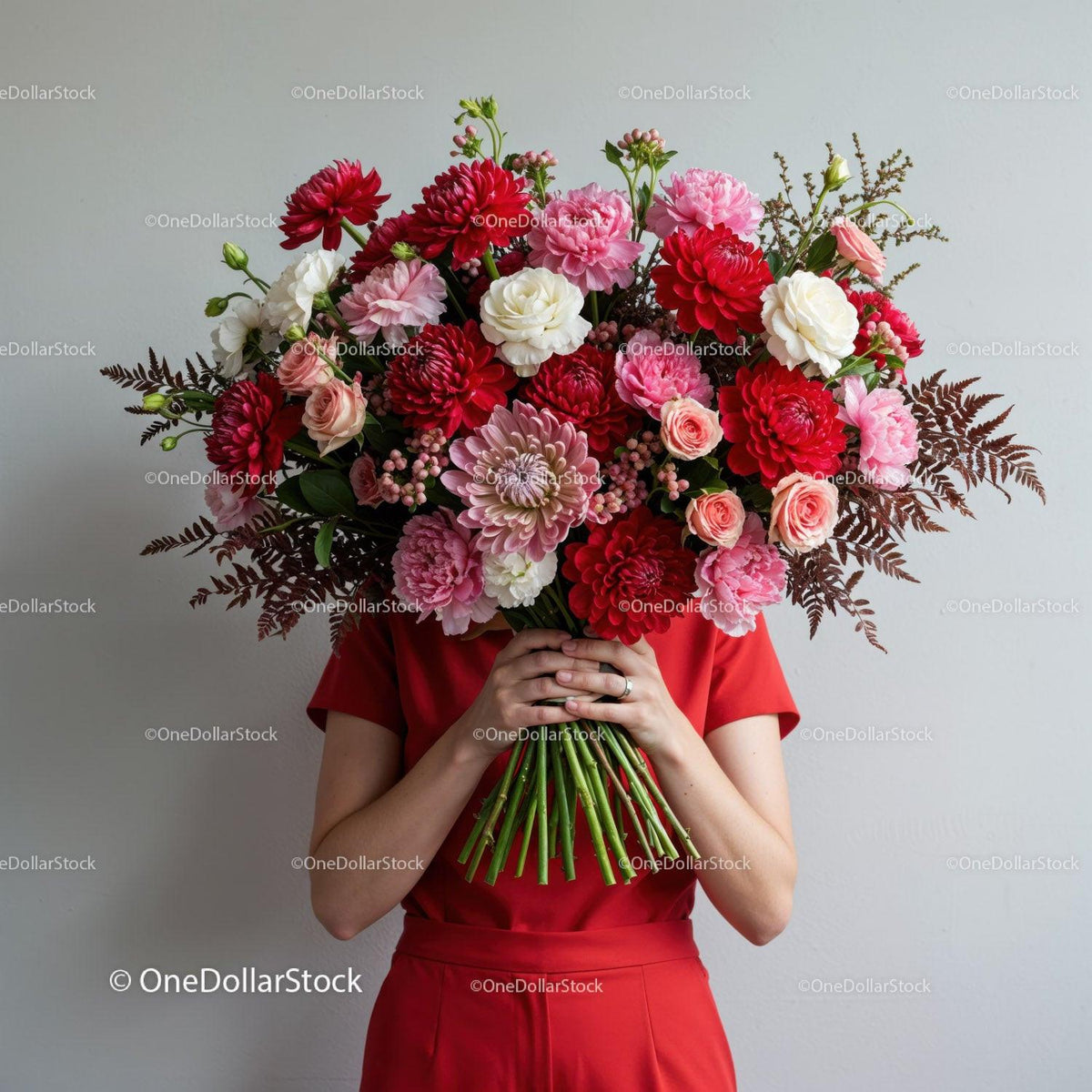 Woman in Red Holding Large Vibrant Flower Bouquet