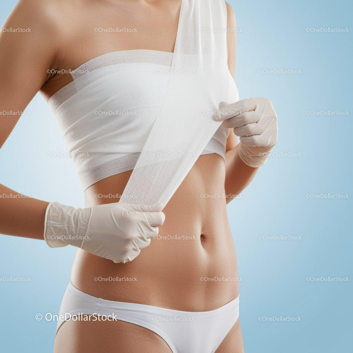 Woman Applying Medical Bandage to Her Midsection in Healthcare Setting