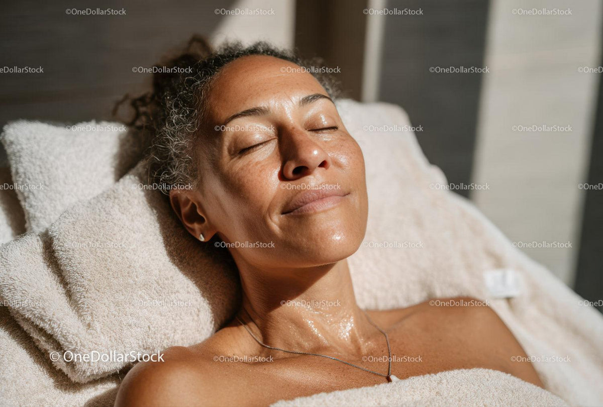 Relaxing Mature Woman Enjoying Skincare Treatment in Spa Setting