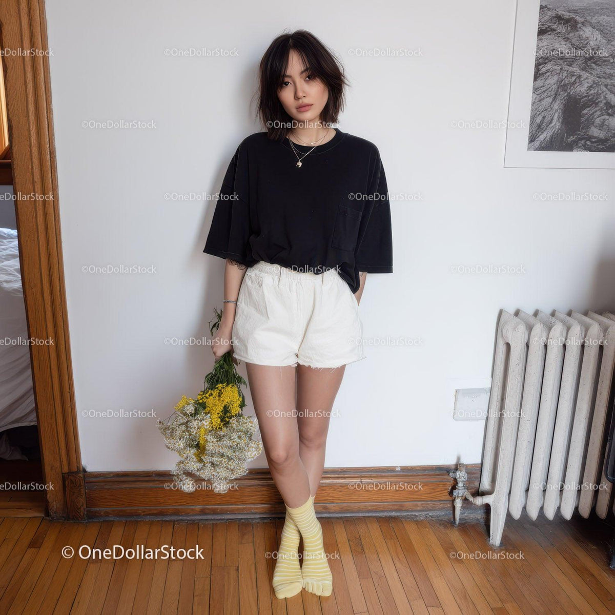 Young Woman in Casual Black T-Shirt and White Shorts Holding Flowers