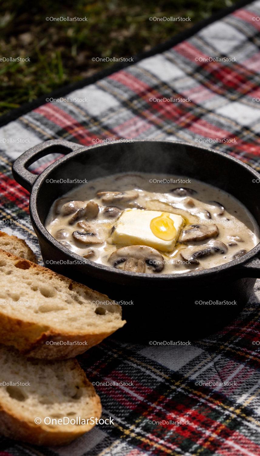 Creamy mushroom sauce with melting butter and bread