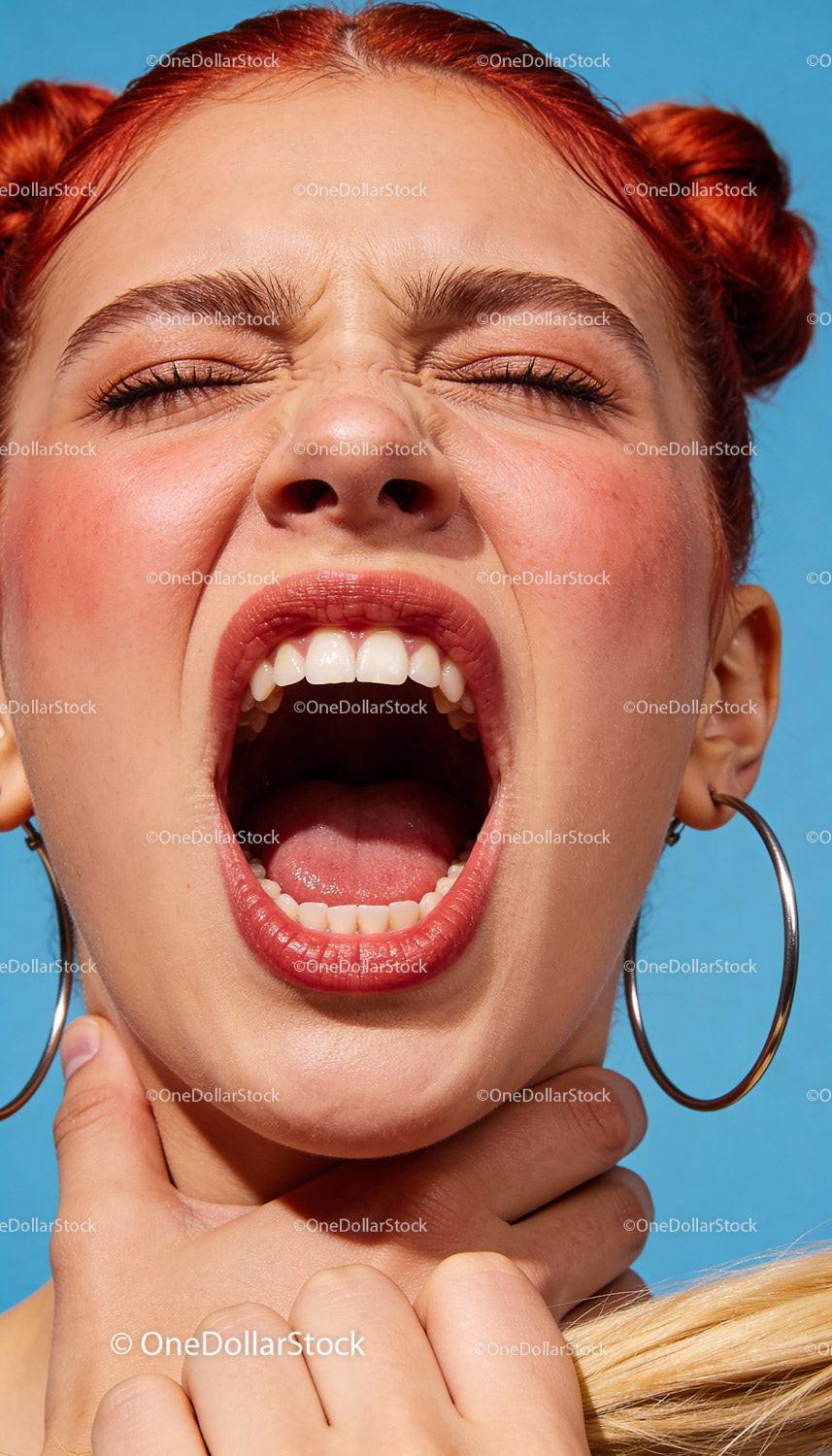 Young woman expressing distress and discomfort outdoors