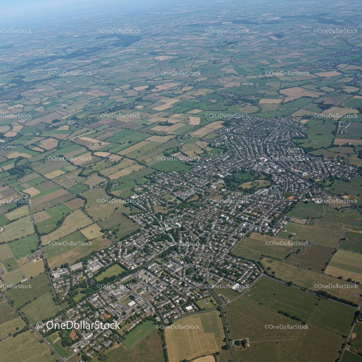 Aerial View of Green Fields and Urban Area with Country Landscape