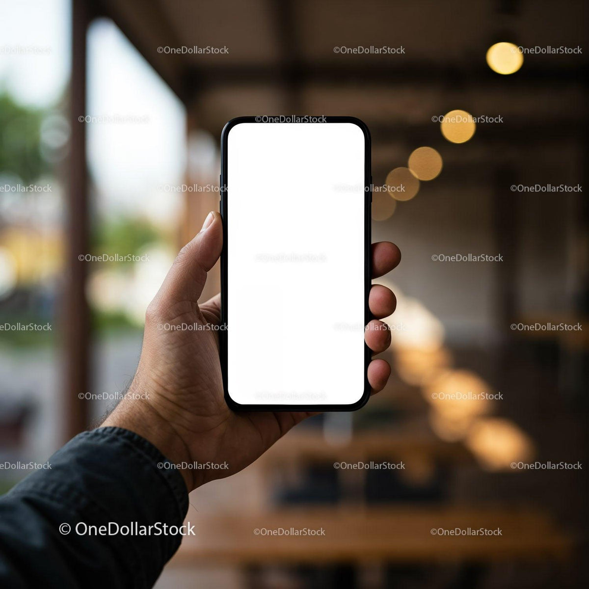 Hand Holding Smartphone with Blank Screen in Cozy Setting JPG Mockup Image preview