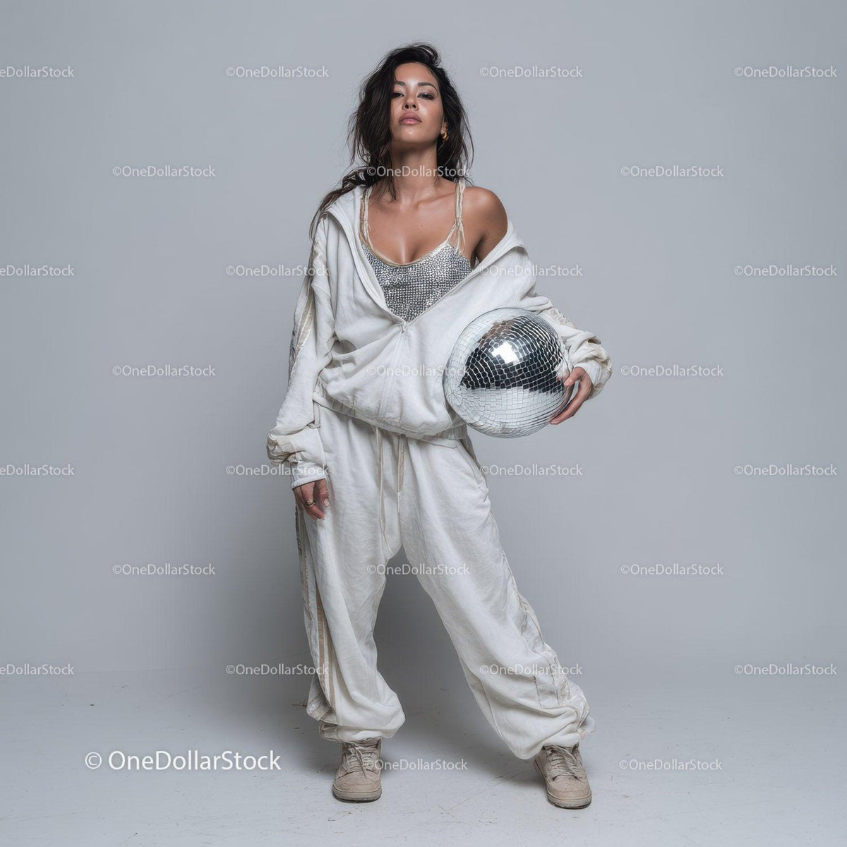 Stylish Woman in Metallic Outfit Holding Disco Ball for Modern Fashion Stock Photo Bundle preview 14