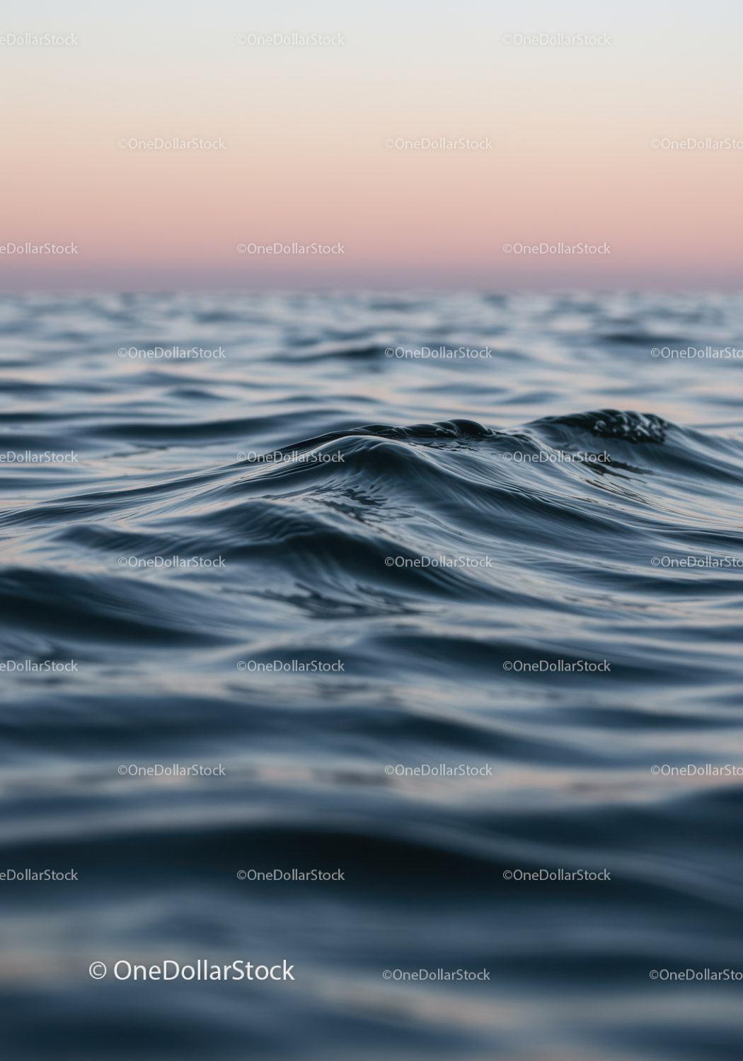 Calm Ocean Surface with Gentle Waves at Sunset