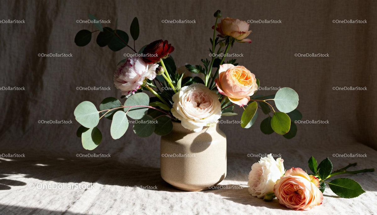 Soft floral arrangement with roses and eucalyptus leaves