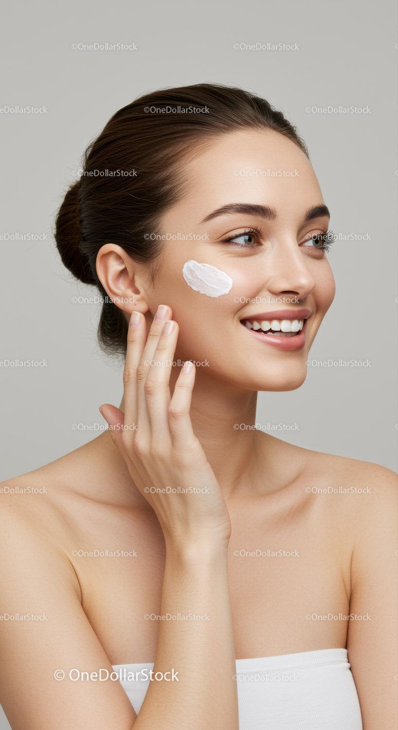 Smiling Woman Applying Skincare Cream with Youthful Skin