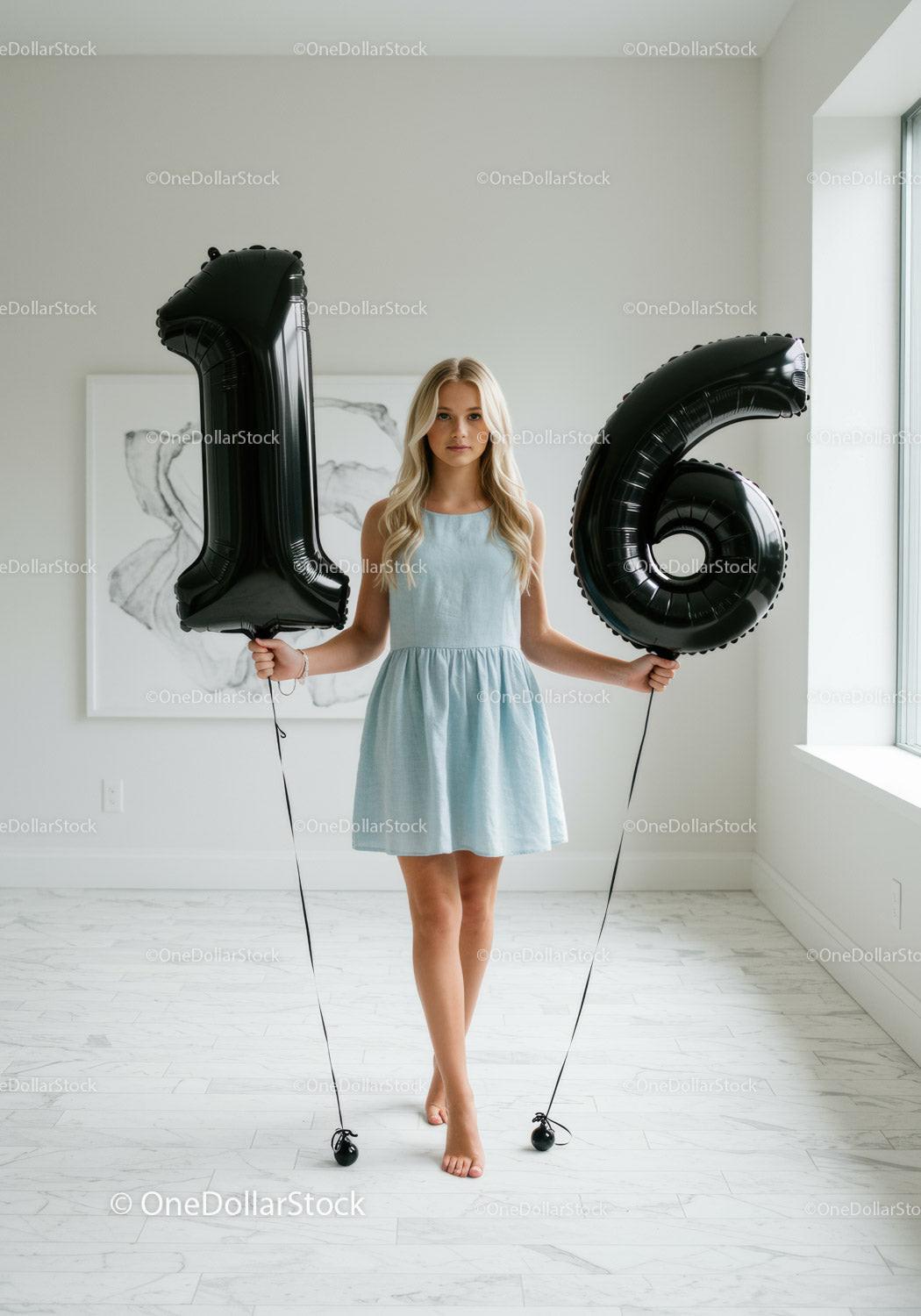 Teen girl celebrating sweet sixteen with black balloons