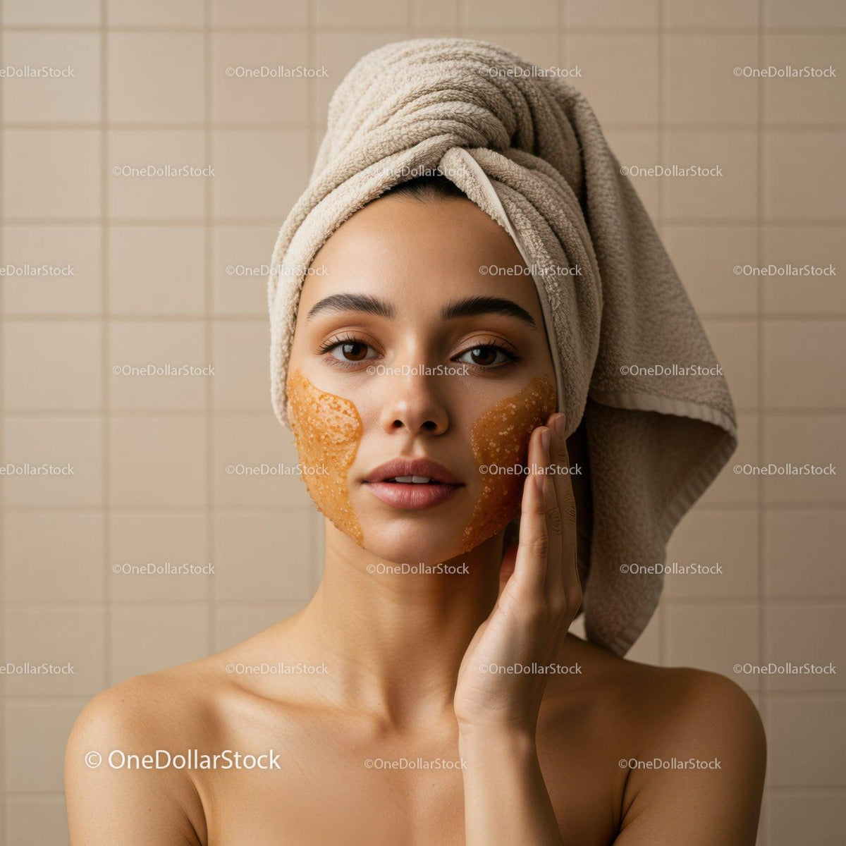 Young Woman Relaxing with Gold Facial Mask and Towel Wrapped Head