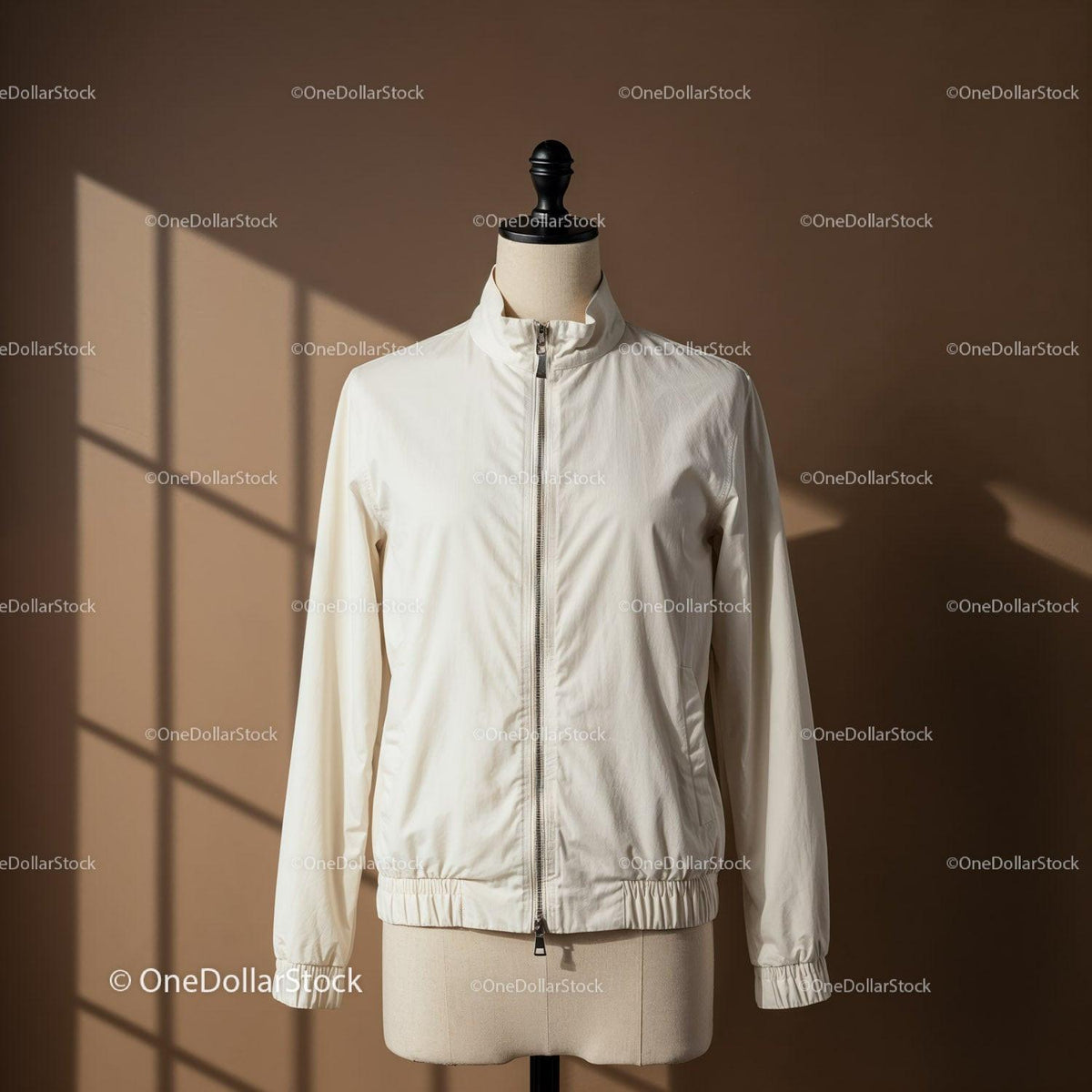 Minimalist white jacket on mannequin with soft shadows JPG Mockup Image preview