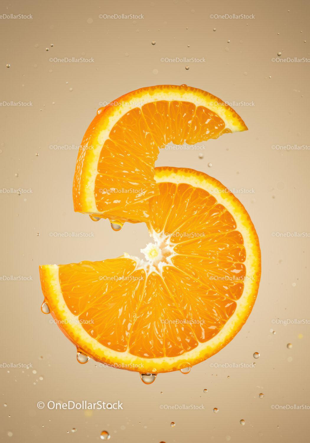 Fresh orange slice submerged in clear water droplets