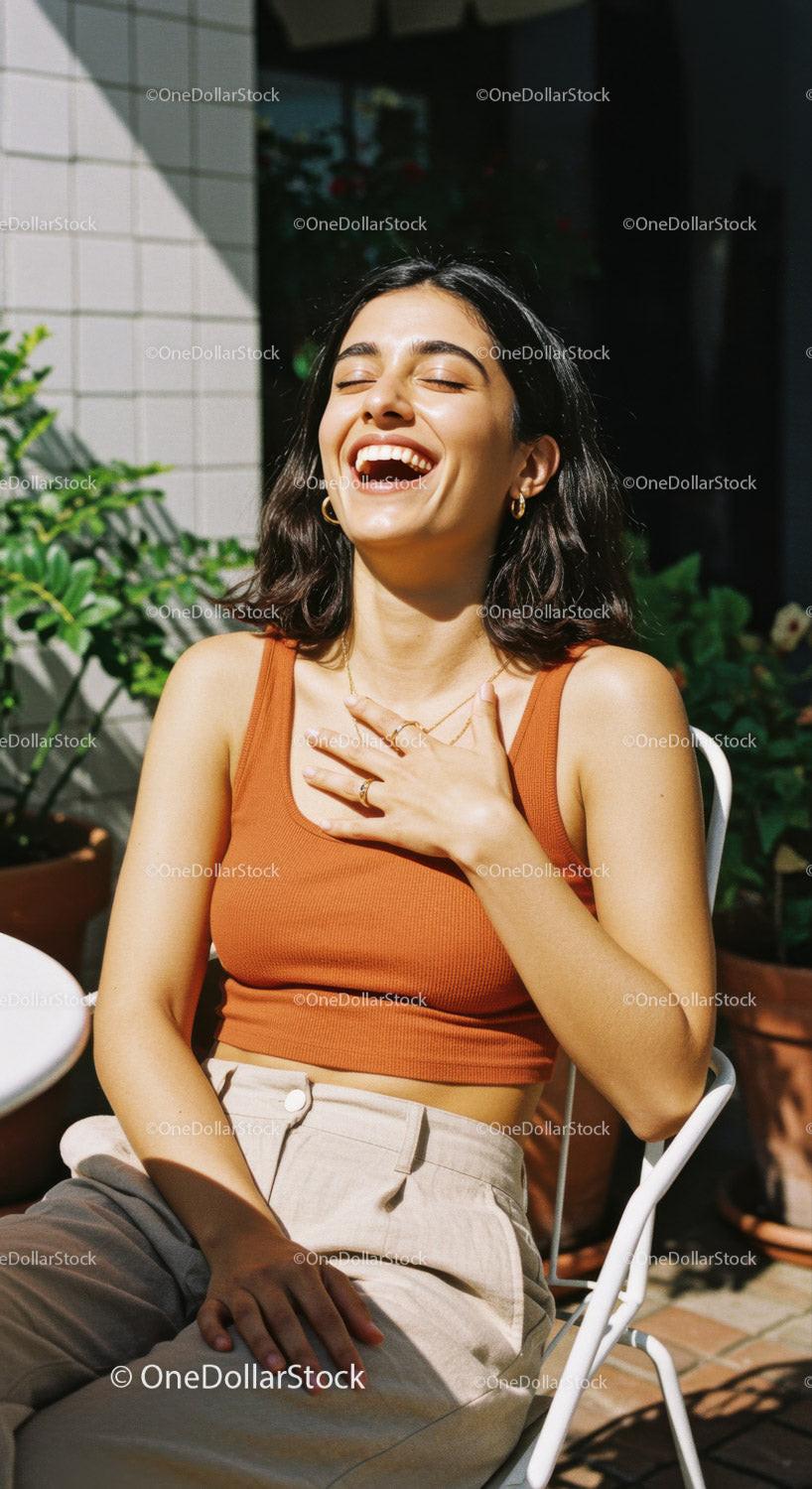 Happy Woman Laughing Outdoors in Sunlight Wearing Stylish Casual Outfit